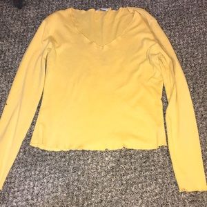 This is a XL yellow shirt with a cotton and rugged finish